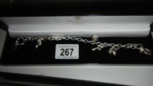 A silver bracelet with charms