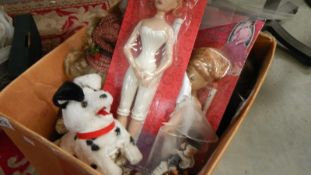 A box of dolls and toys