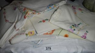 A quantity of embroidered clothes