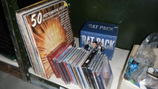 A collection of CDs and records including The Ratpack box set