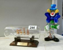 A Murano clown & Tea Clipper in a bottle