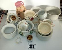A collection of miniature pots including Hitler Gest-a-Po