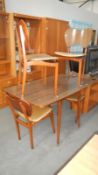 A retro dining table with 4 chairs