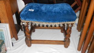 An upholstered footstool