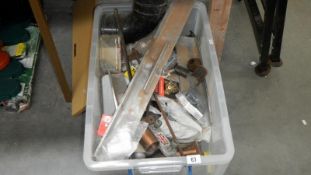 A large box of sundry items and a collapsable work bench
