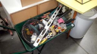 A wheelbarrow and contents of tools