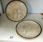 2 European figural relief plates featuring weather scenes