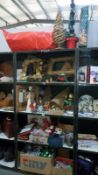 5 shelves of Christmas decorations