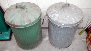 2 metal lidded bins