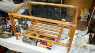 A cane glass topped coffee table