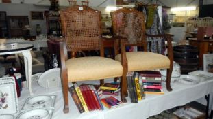 A pair of bergere arm chairs