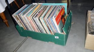 A box of assorted LPs