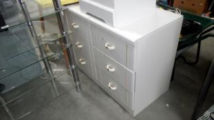 A pair of 3 drawer white chest of drawers