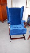 An upholstered rocking chair (matches lot 437)