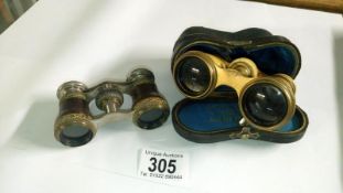 A cased pair of opera glasses (F Gamm,