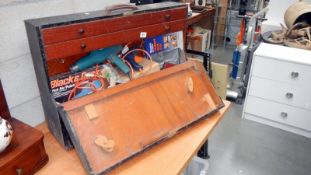 An old tool box with electric drills and other tools