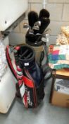 A set of Taylor Made golf clubs in bag and one other bag