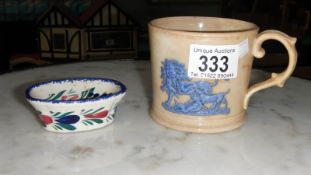 An old embossed cup and a quimper pin dish