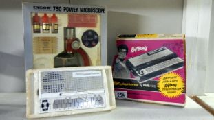 A TASCO 750 Power Microscope and a boxed Rolf Harris Stylophone