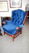 An upholstered armchair (matches lot 438)