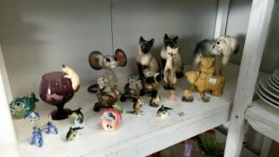 A quantity of animal figures including cats & dog etc.