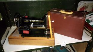 A cased Singer sewing machine