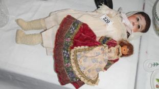 A S F B J 60 Paris doll in original clothes and an early plastic doll
