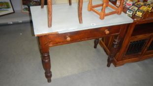 A kitchen table with drawer