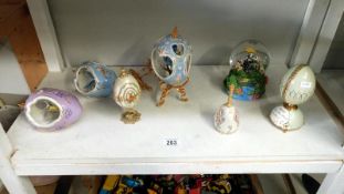 A quantity of ornaments including a musical porcelain egg etc