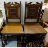 Pair of Victorian Oak Hall Chairs, the backs inset with floral panels, over oak seats and turned and