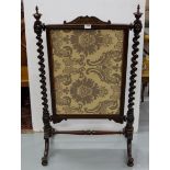 WMIV Mahogany Framed Fire Screen, with roped side supports and an ascending screen, covered with