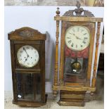 2 spring driven wall clocks, 1 in a walnut case and 1 in a marquetry inlaid case (not working)