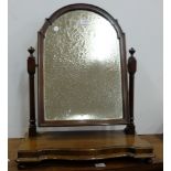 Edwardian Mahogany Toilet Mirror, the pivoting central mirror over shaped front base, 4 turned feet,