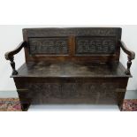 18thC Irish Carved Oak Hall Bench, the hinged seat enclosing a compartment, the front and back