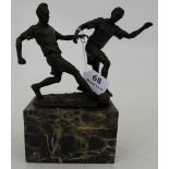 Bronze Table Group – Football Tackle, on a high black veined marble base, 9”h