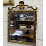 Early 20thC Brass Framed Wall Mirror, with bevelled edges, a shell shaped pediment with swag