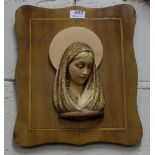 Raised plaque of Madonna on a inlaid mahogany base, 13” x 15”h