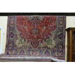 Wool floor rug, with central red ground pattern and blue ground multiple borders, 140” long