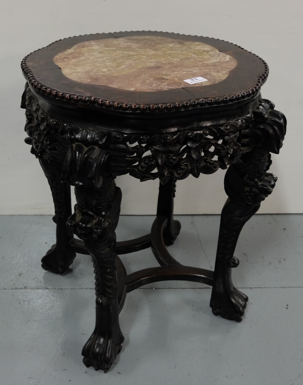 Victorian Chinese Hardwood Lamp Table, with a button detailed circular shaped top, inset with red