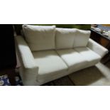 Large Modern “Desiree” brand 3-seater Couch, with removable beige linen cover and 3 feather loose