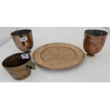 4 antique copper items – pair of oval shaped jelly moulds, Persian cup decorated in relief with