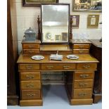Early 20thC Mahogany Dressing Table, the central swivel mirror between a gallery of two drawers on