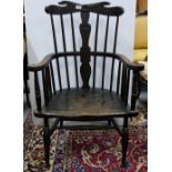 19thC Elm Windsor Armchair, the spindle back inset with floral detailed splat, the seat carved