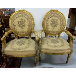 Pair of Gilded Wood Salon Armchairs, the oval backs and seats covered with floral tapestry fabric,