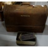 Singer Sewing Machine with carrying case & tin of sewing parts