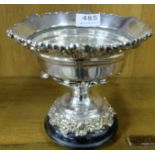 Late 19thC heavy silver plated centre bowl with ornate mouldings, on a wooden base with 3 turned