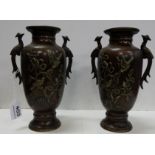 Matching Pair of Japanese Bronze Vases, decorated in relief with peacock handles, flowers and birds,