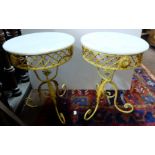 Matching Pair of Wrought Iron Garden Tables, circular, with leaf-shaped mounts, and white marble