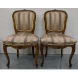 Matching Pair French Walnut Framed Side Chairs, the oval topped padded backs and seats covered in (