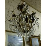 French Gilded Chandelier, with multiple drop crystals, 4 internal light fittings and 8 scrolled